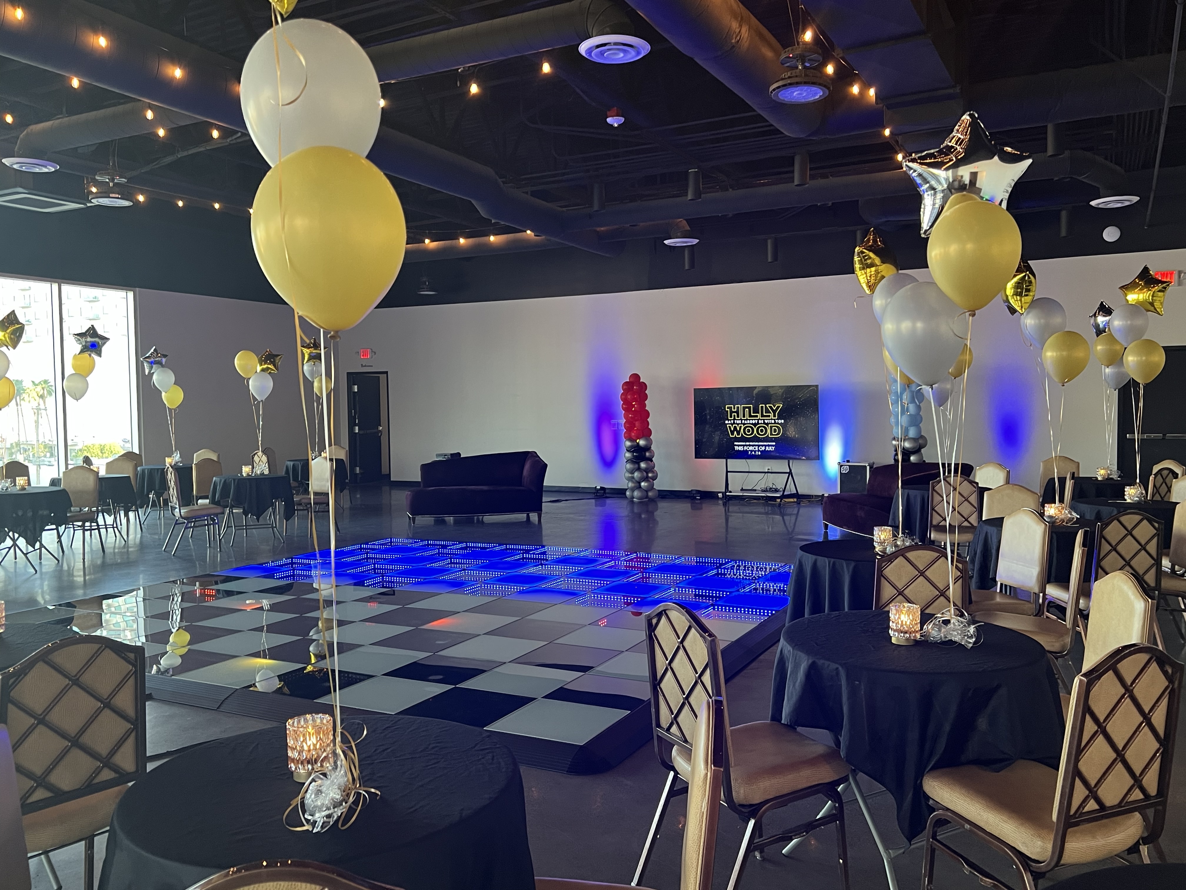 Cocktail tables and a dance floor set for a celebration